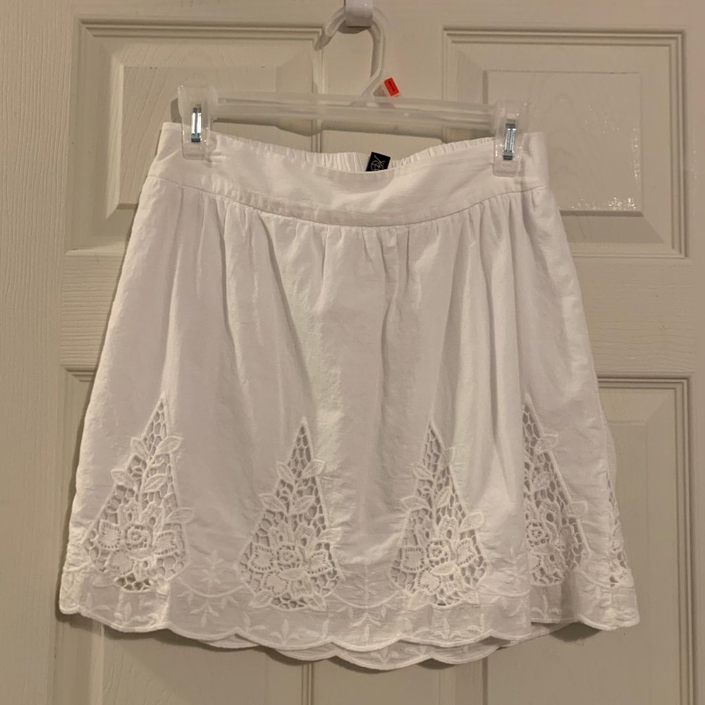 White skirt with lace design